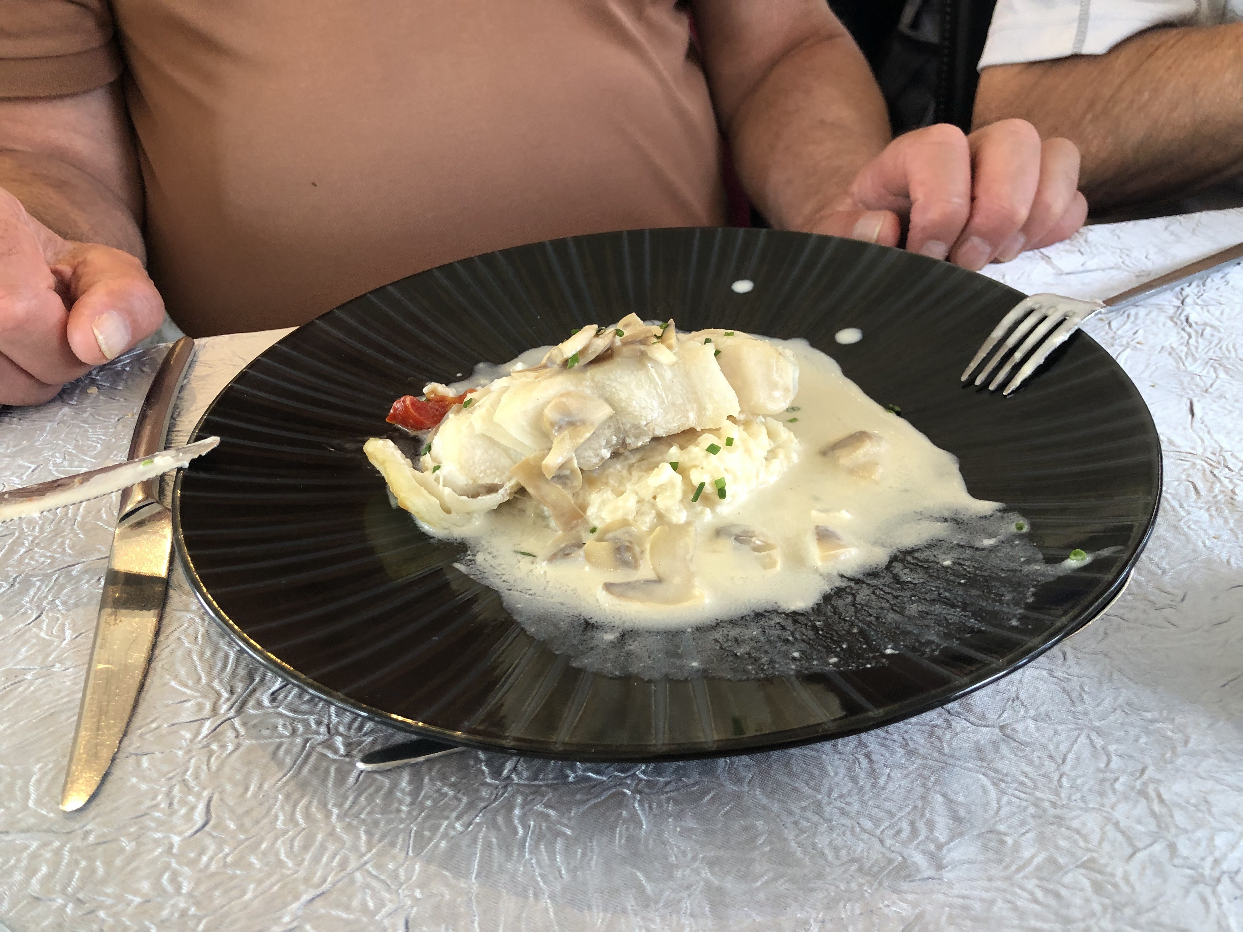 Lieu noir sauce <bonne femme > risotto .